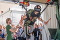 Man experimenter feels the installation simulator skydiving glasses with virtual reality and flight simulation computer program ha