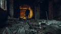 Man explorer with flashlight inside corridor or tunnel of ruined industrial building factory, horror and creepy