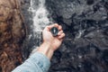 Man Explorer Searching Direction With Compass In Waterfalls, Point Of View Shot Royalty Free Stock Photo