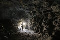 Man explores a cave Royalty Free Stock Photo