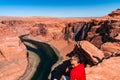 Man exploring horseshoe bend by the river Colorado