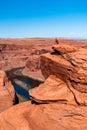 Man exploring horseshoe bend by the river Colorado