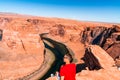 Man exploring horseshoe bend by the river Colorado