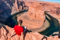 Man exploring horseshoe bend by the river Colorado