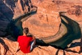 Man exploring horseshoe bend by the river Colorado