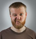 Man with an expression of discontent on his face Royalty Free Stock Photo