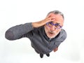 Man with expression of forgetfulness or surprise on white background