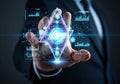 Man extending hand toward a glowing digital interface, showing a data analysis concept for global business network and technology Royalty Free Stock Photo