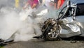 Man extinguishes the car with a fire extinguisher.