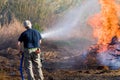 Man extinguishing fire