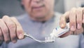 Man extrude a toothpaste from a tube on a toothbrush Royalty Free Stock Photo