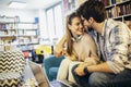 Man in eyeglasses and charming woman using laptop resting at cafe with cup of coffee Royalty Free Stock Photo