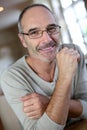 Man with eyeglasses sitting at home