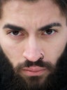 Man face with beard and nose piercing