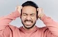 Man, face and frustrated with stress headache, anxiety and mental health isolated on studio background. Male with eyes Royalty Free Stock Photo