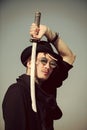 Man face handsome. Warrior in sunglasses, black hat and clothes