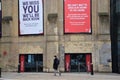 A man with a face mask walks past the Roundhouse in Camden, London