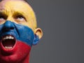 Man face painted with colombian flag. Royalty Free Stock Photo