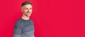 Man face portrait, banner with copy space. cheerful handsome man wear sweater on red background, lifestyle.