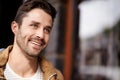 Man, face and smile in city with fashion on mockup space with urban style, trendy outfit and confidence. Male person Royalty Free Stock Photo