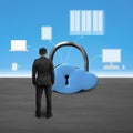 Man facing cloud shape lock with computing devices Royalty Free Stock Photo