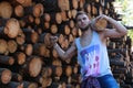 A man at the factory processing wood, sawing logs Royalty Free Stock Photo