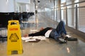 Man fallen on wet floor Royalty Free Stock Photo