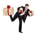 Man with falling gift box run. Royalty Free Stock Photo