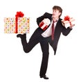 Man with falling gift box run. Royalty Free Stock Photo