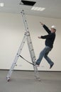Man falls from ladder Royalty Free Stock Photo