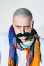 Man with false moustache and colored scarf Royalty Free Stock Photo