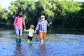 Man family fishing. Father, son and grandfather relaxing together. Grandfather and father with cute child boy are Royalty Free Stock Photo