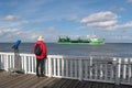 A man on the famous viewing platform Alte Liebe in Cuxhaven, Germany.