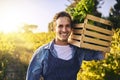 Man, farm and crate with produce in portrait with harvest, success and happiness for agriculture. Male farmer, box and Royalty Free Stock Photo