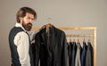 Man fashion clothes designer presenting tailored collection, special day concept