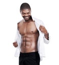 Man, fashion and muscle with abs, shirt and dressing for chest, african and male model in white background. Alone, smile Royalty Free Stock Photo