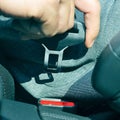 Man fastening the car safety belt