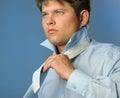 The man fastening necktie Royalty Free Stock Photo