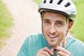 Man Fastening Strap Of Cycling Helmet Royalty Free Stock Photo