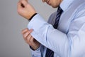 Man fastens his cuff links close-up Royalty Free Stock Photo