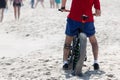 A man on a fat wheel bike on the beach Royalty Free Stock Photo