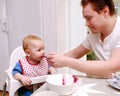 Man feeding baby