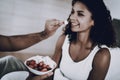 Man Is Feeding His Girlfriend With A Strawberry. Royalty Free Stock Photo