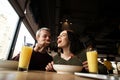 Man feeding his girlfriend a tomato. WAttractive woman smiling and dreamly smiling. She is happy that she will get more Royalty Free Stock Photo