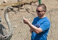 Man feeding ostrich Royalty Free Stock Photo