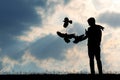 Man feeds the pigeons at sunset