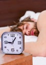 Man feeling back ache in the bed after sleeping. Stretch after wake up in the morning. Portrait of a man sleeping in the Royalty Free Stock Photo