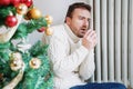 Man feeling cold at home with home heating trouble during Christmas Royalty Free Stock Photo