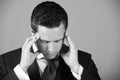 Man feeling headache with stylish hai in blue suit Royalty Free Stock Photo