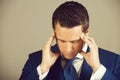 Man feeling headache with stylish hai in blue suit Royalty Free Stock Photo